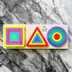 Triplet Geometric Shapes Puzzle with colorful wooden circles, triangles, and squares on a wooden board