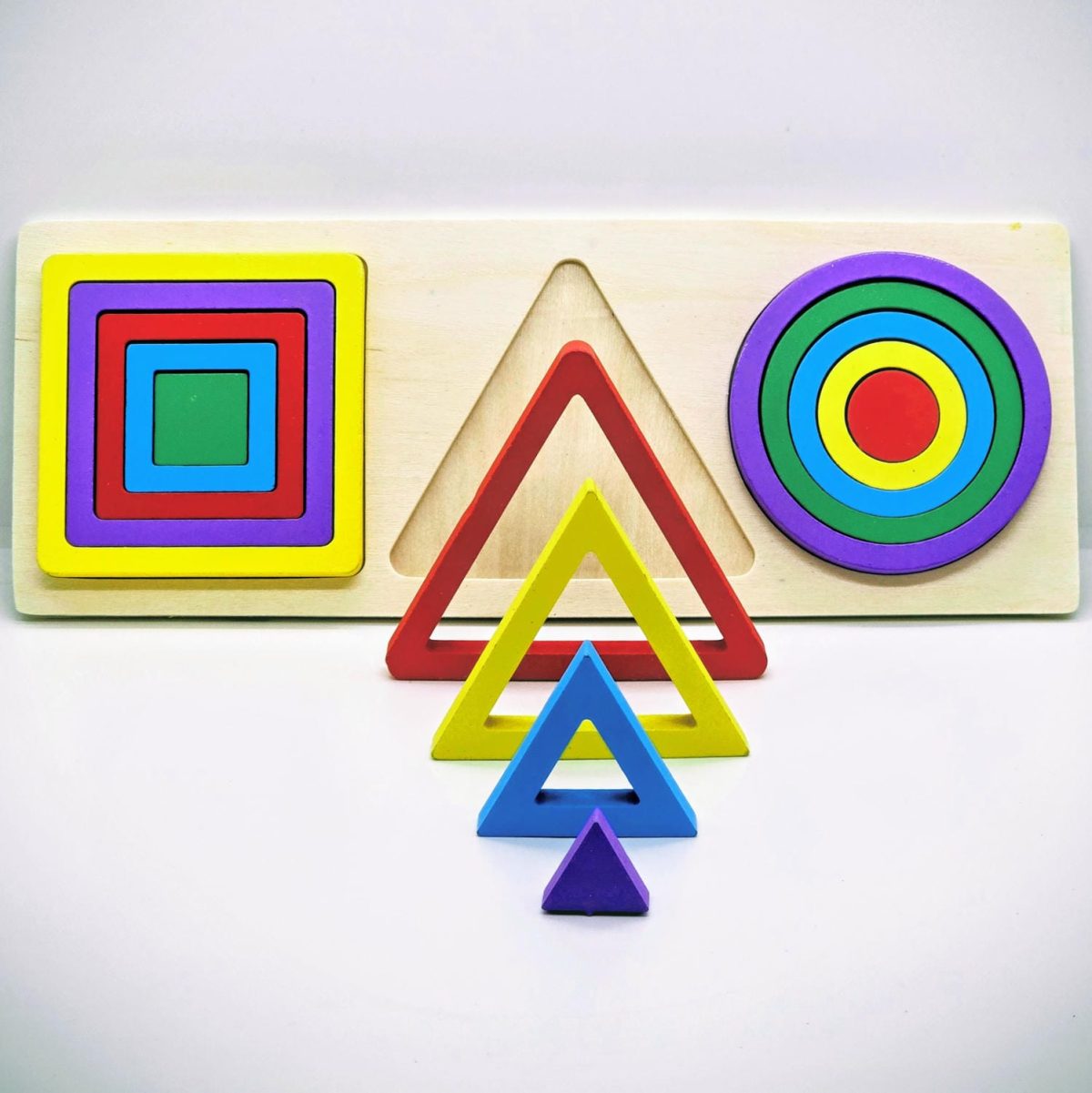 Triplet Geometric Shapes Puzzle with colorful wooden circles, triangles, and squares on a wooden board