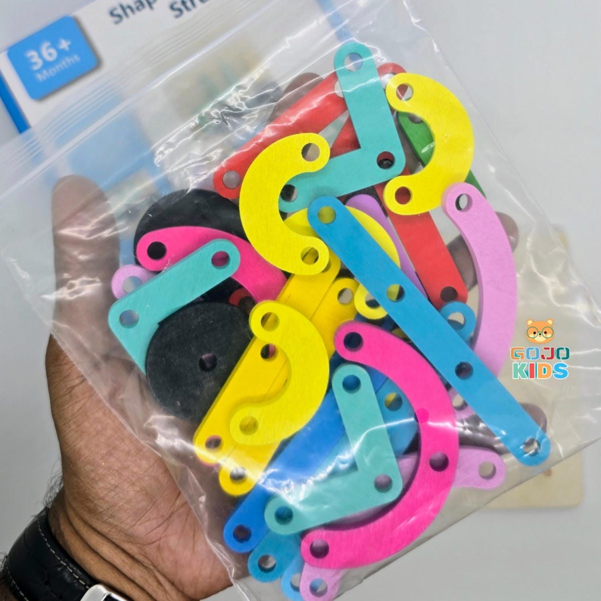 Shape & Structure Activity Set with colorful wooden sticks, blocks, and a manual for building creative objects