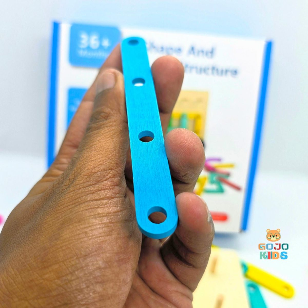 Shape & Structure Activity Set with colorful wooden sticks, blocks, and a manual for building creative objects