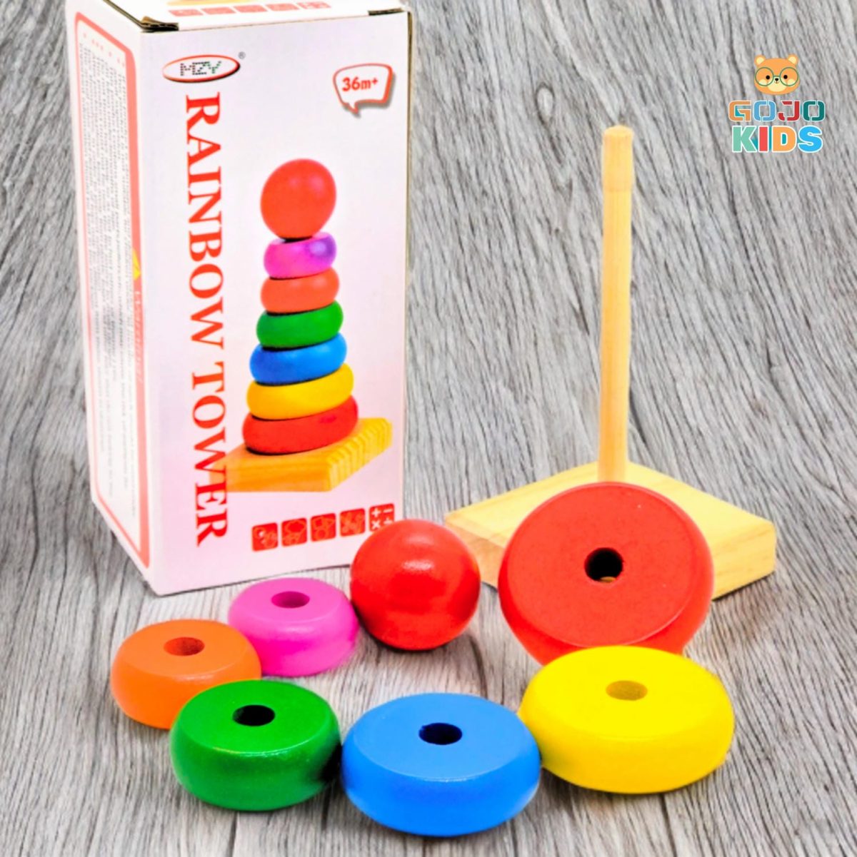 Wooden Rainbow Tower Stack with colorful rings and a wooden base for toddler skill development